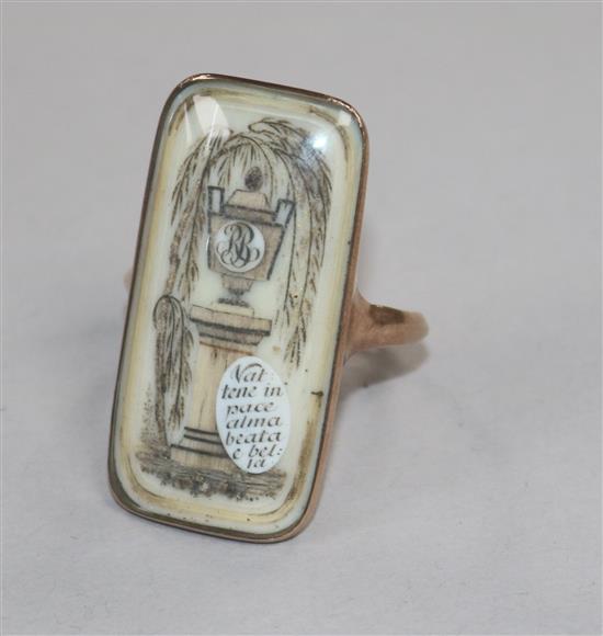 An early 19th century yellow metal and ivory mourning ring,